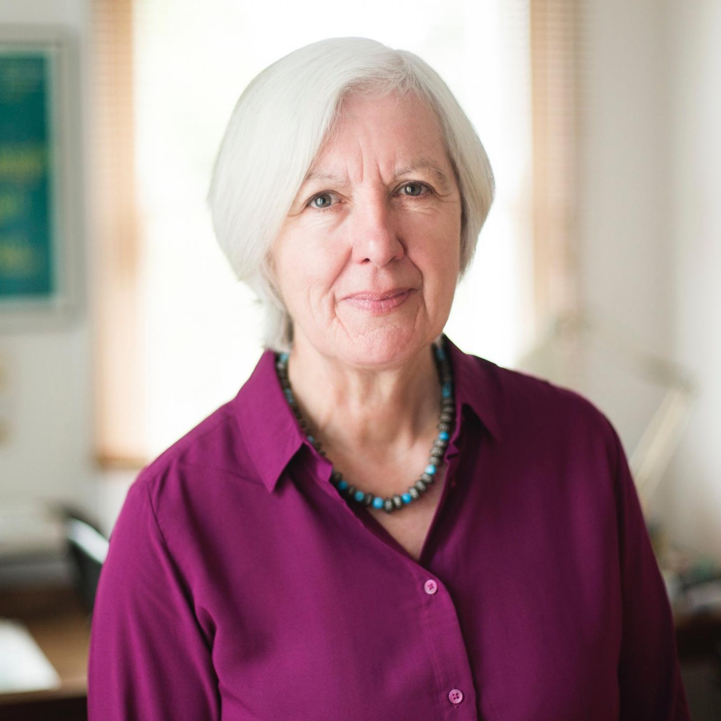 Judith Weir (female composer with white hair, stood in a study in purple shirt)