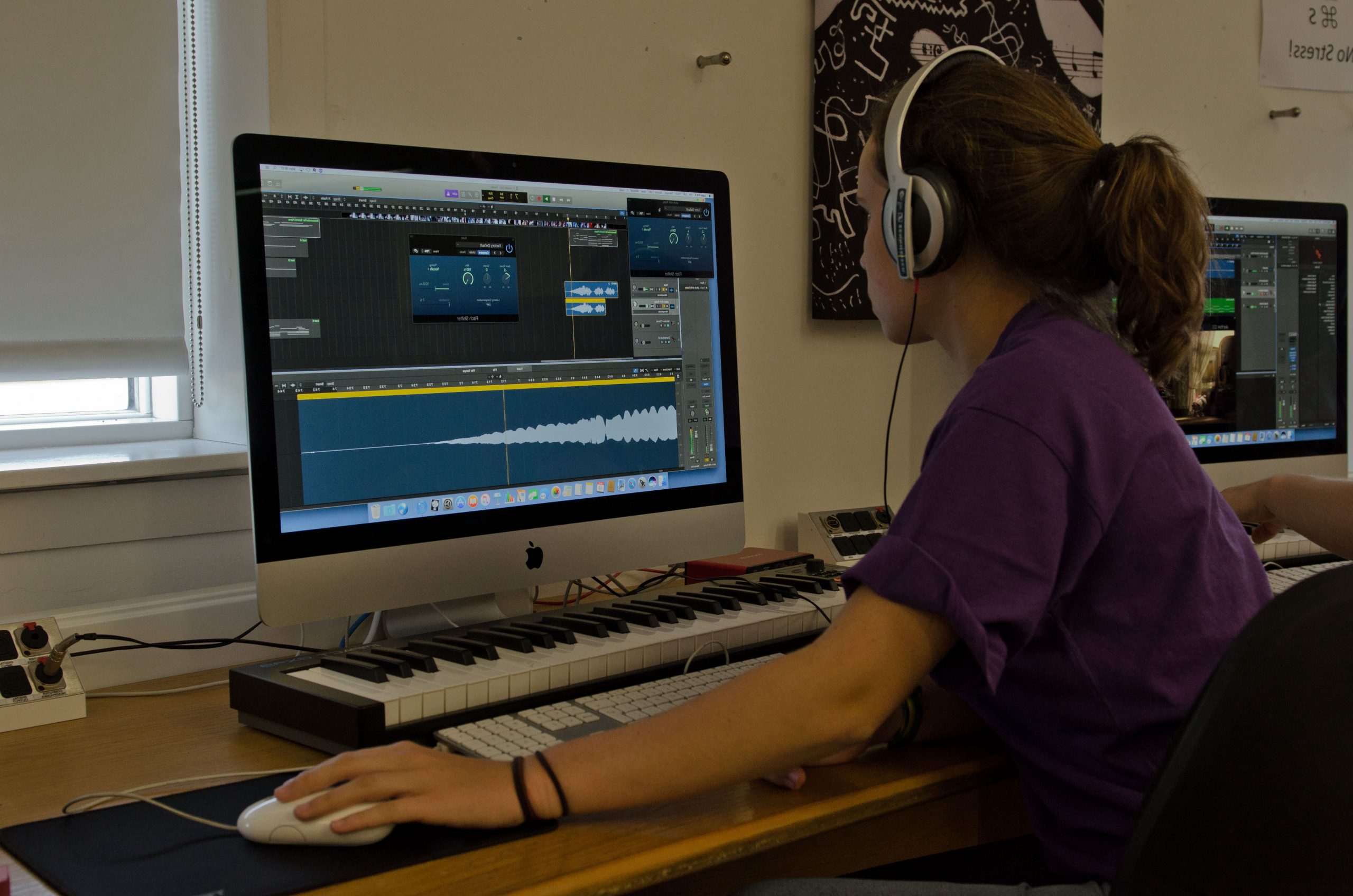 A student working at a computer workstation