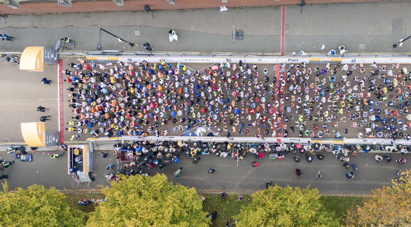 Georgie Buchanan plays the harp in a woodland environment